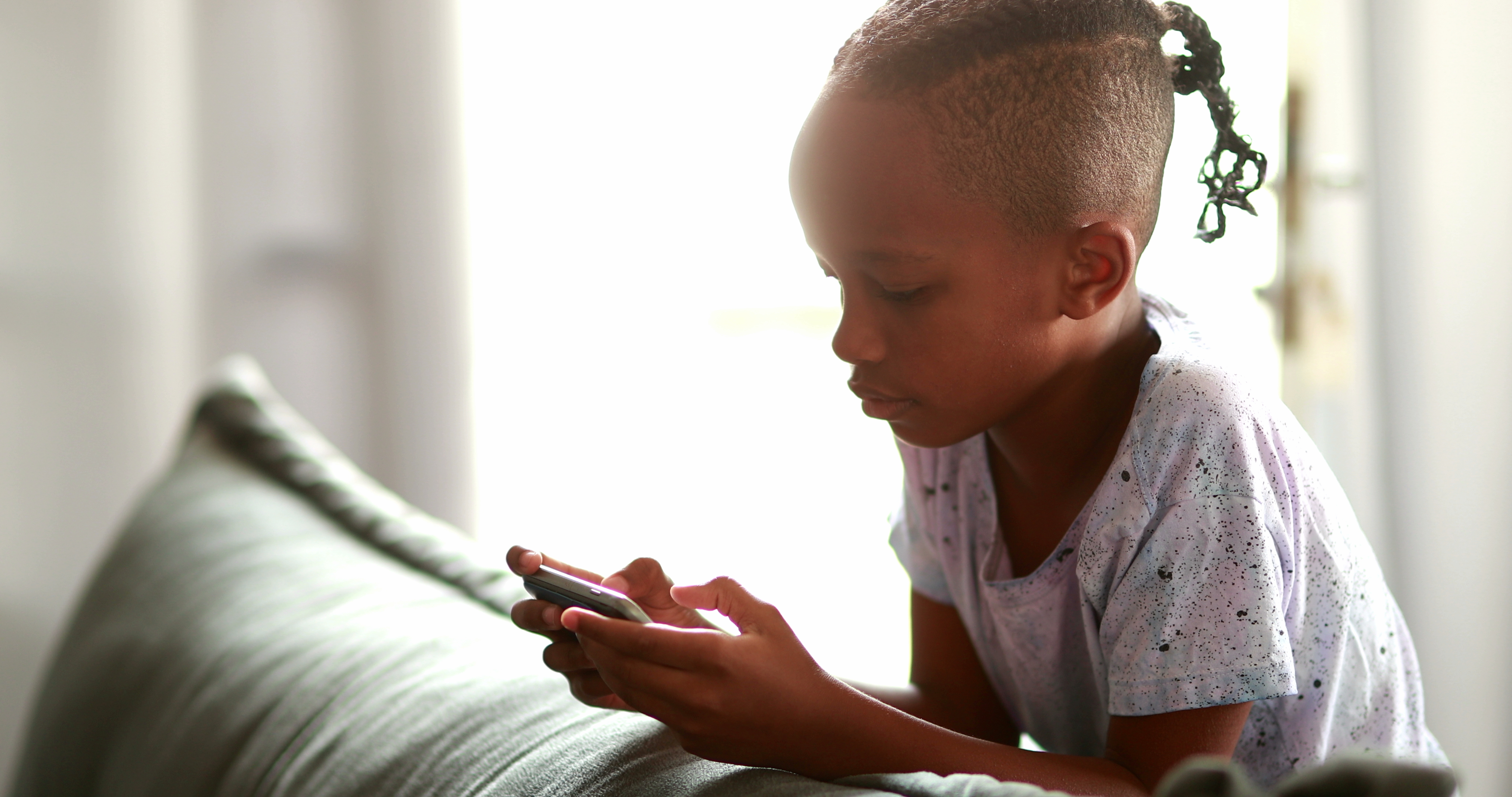 Kid,Scratching,Face,While,Using,Phone,Playing,Game