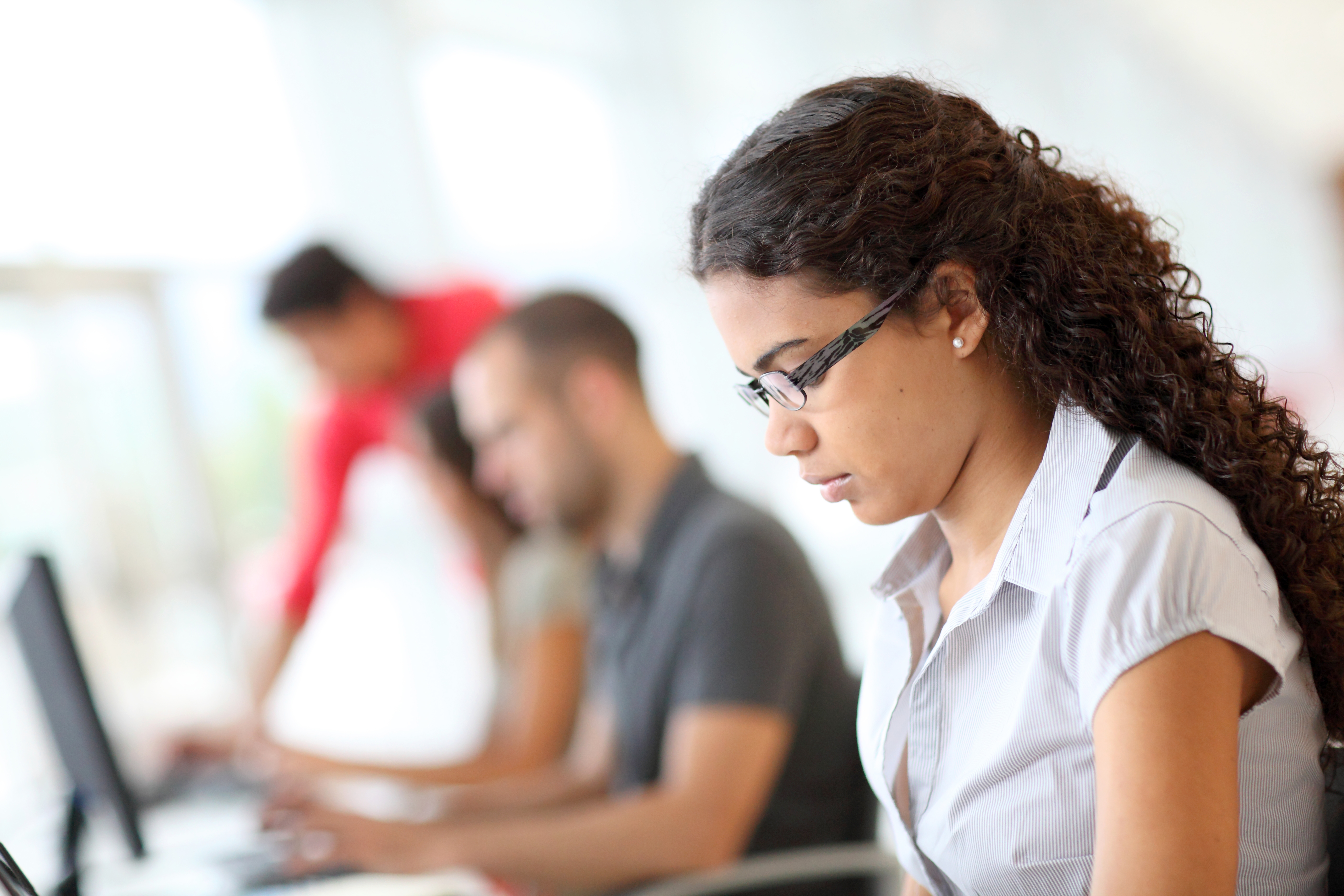 Portrait,Of,Smiling,Student,In,Front,Of,Laptop,Computer