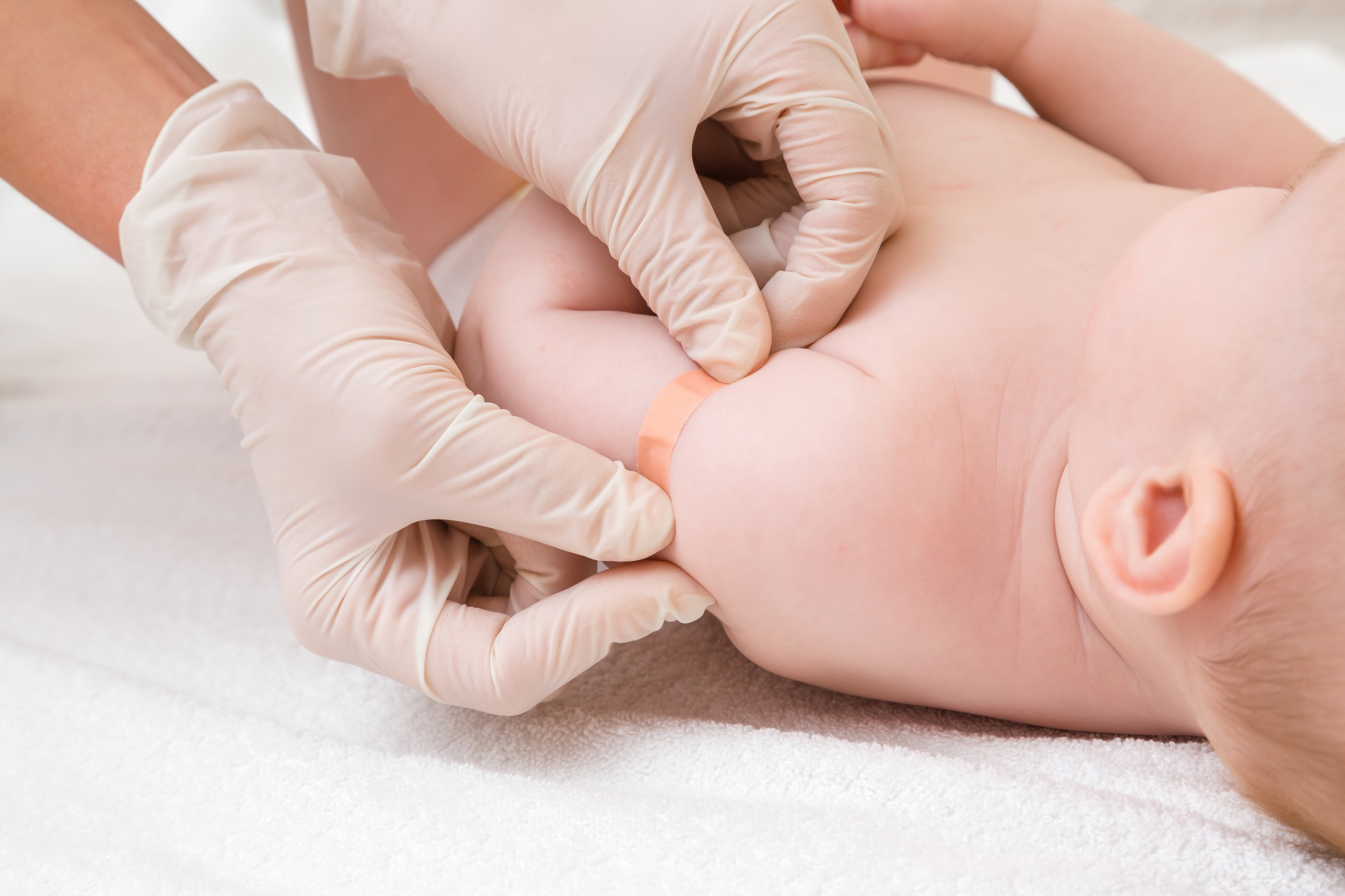 Doctor,Hands,In,White,Rubber,Protective,Gloves,Putting,Adhesive,Bandage