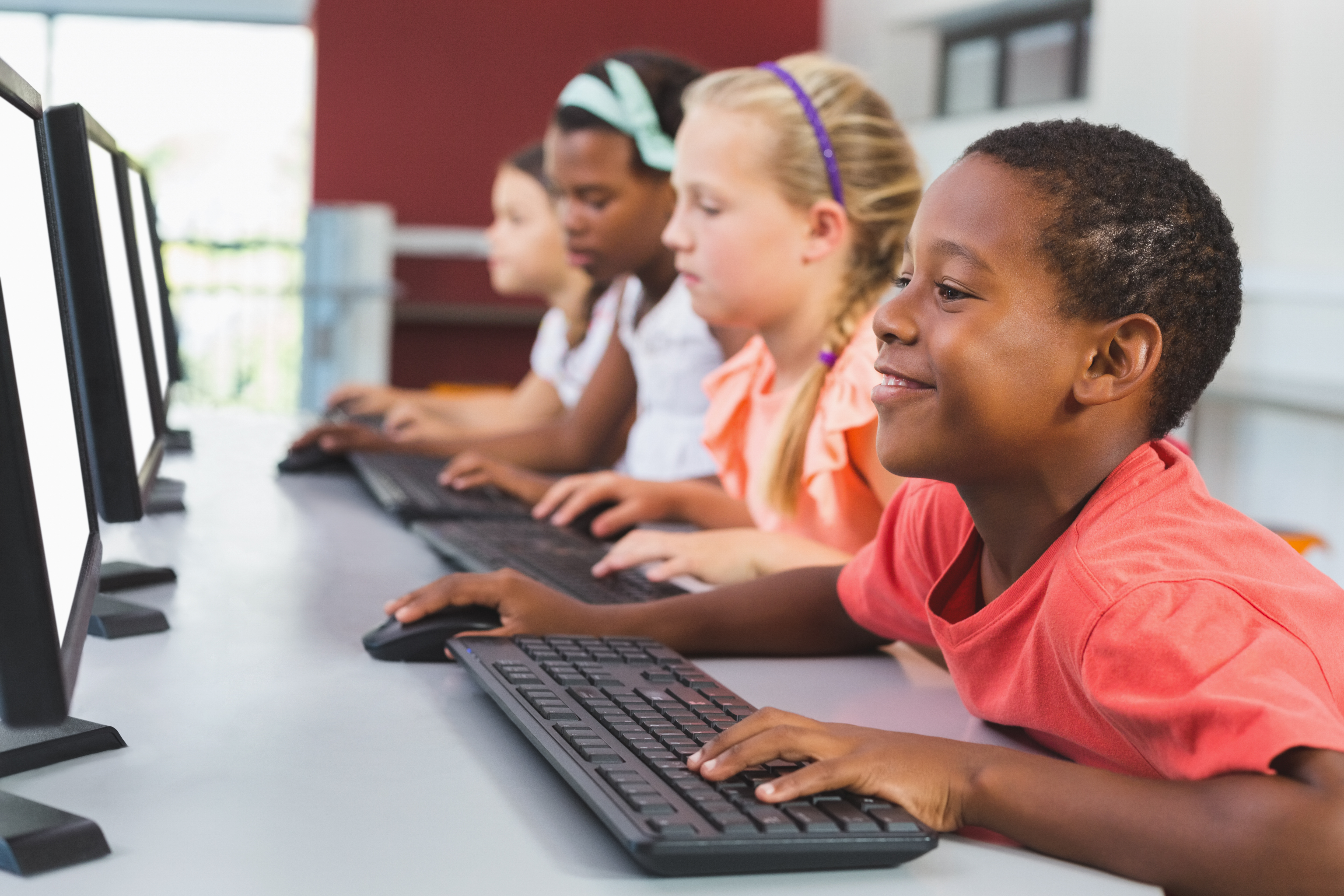 School,Kids,Using,Computer,In,Classroom,At,School